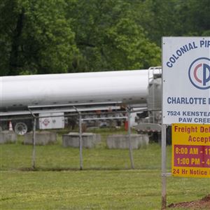 Tanker trucks parked near the entrance of Colonial Pipeline Company Wednesday, May 12, 2021, in Charlotte, N.C.  After the ransomware assault on Colonial Pipeline in May the administration moved to curb ransomware attacks, including launching an initiative that included the creation of a global coalition to target countries that harbor ransomware criminals.  