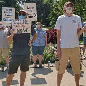 Penn State faculty members rally on the university's main campus in State College on Aug. 13, 2021, to demand the university implement a COVID-19 vaccine mandate. The school on Oct. 13 announced it will require the shots for faculty and staff by December.