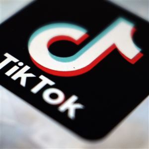 In this Monday, Sept. 28, 2020 photo, a logo of a smartphone app TikTok is seen on a user post on a smartphone screen, in Tokyo.