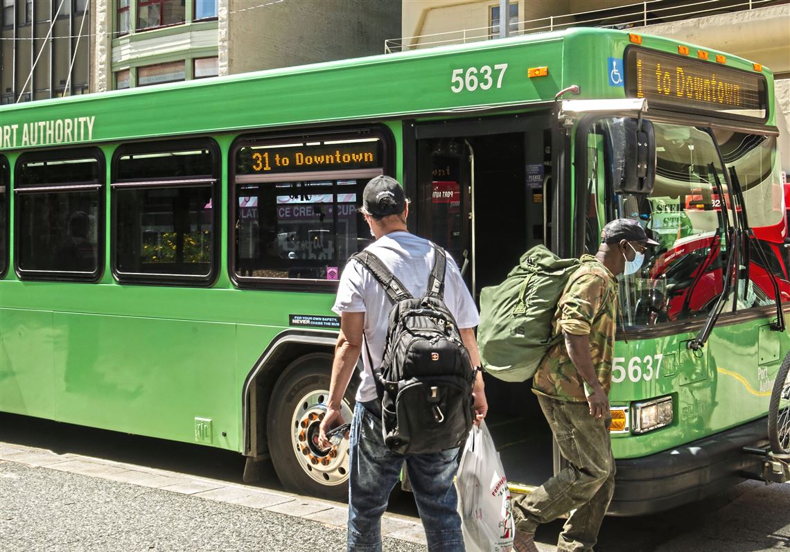 Masked passengers board a Port Authority bus near Market Square on Wednesday, June 23, 2021