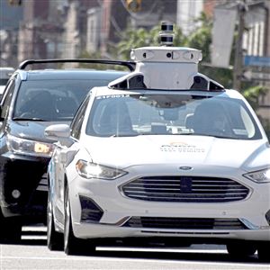 An Argo AI autonomous vehicle sits at a red light on Liberty Avenue, Tuesday, June 30, 2020, in Bloomfield.