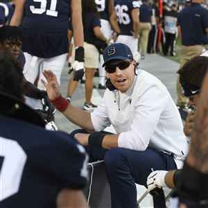 Penn State offensive line coach Phil Trautwein talks with his players during an NCAA college football game against Ball State in State College, Pa., on Saturday, Sept.11, 2021.