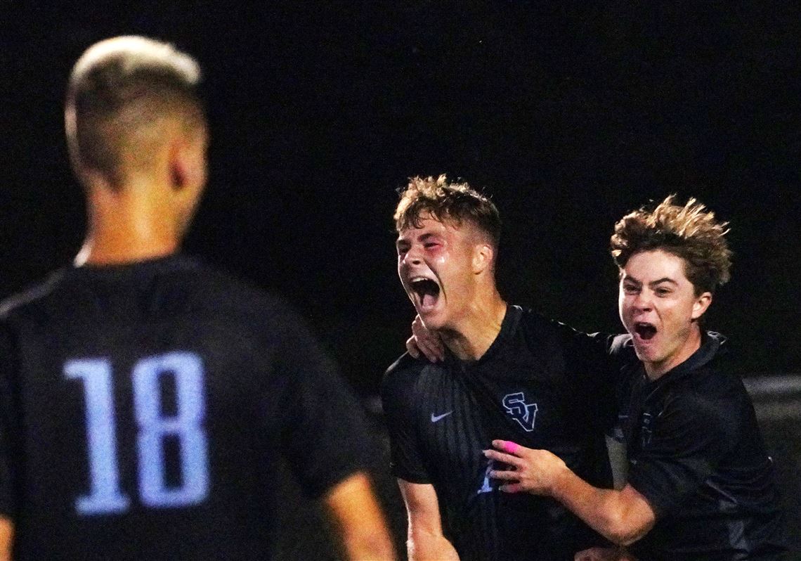Seneca Valley’s Connor Oros, center, and Will Bruno celebrate with Benjamin Randall (18) after Oros scored the first goal of the game on Tuesday, Sept. 20, 2022, at Seneca Valley High School. Seneca Valley won 3-2 in overtime. 