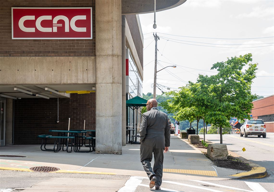 CCAC President Quintin Bullock walks down the sidewalk of the North Side campus on Monday, May 22, 2023. 