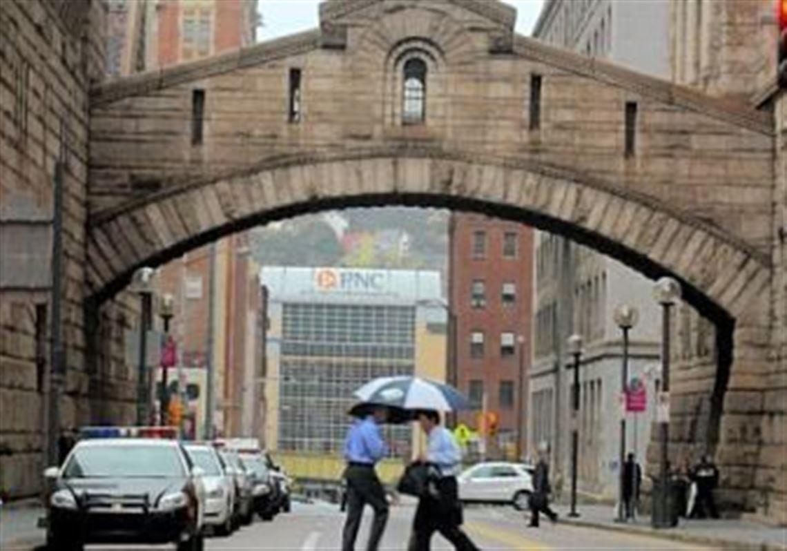 The "bridge" looms over Ross Street and connects to Court of Common Pleas building, formerly to old Allegheny County Prison, to the Allegheny County Courthouse in Downtown Pittsburgh. 