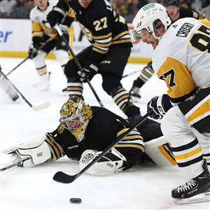 BOSTON, MASSACHUSETTS - JANUARY 04: Sidney Crosby #87 of the Pittsburgh Penguins takes a shot against Jeremy Swayman #1 of the Boston Bruins during the second period at TD Garden on January 04, 2024 in Boston, Massachusetts. (Photo by Maddie Meyer/Getty Images)