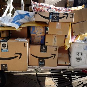In this Oct. 10, 2018, file photo, Amazon Prime boxes are loaded on a cart for delivery in New York. 