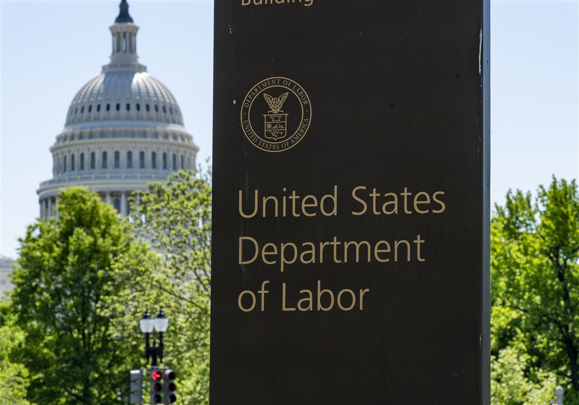 In this May 7, 2020, photo, the entrance to the Labor Department is seen near the Capitol in Washington. 