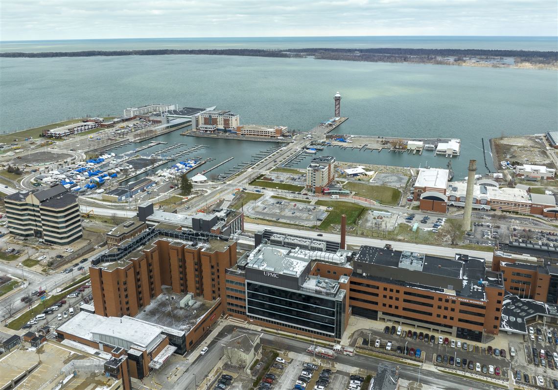 The Bicentennial Tower, in the background-center, looks over the coast of Presque Isle Bay on Thursday, March 21, 2024, in Erie. 