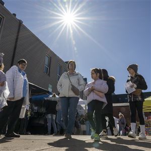 Market-goers walk around the Spring market by Copper Carriage on Saturday, April 6, 2024, in Erie. People from all over are flocking to Erie this week as it’s in the path of totality of the Eclipse on Monday. 