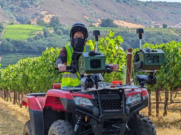 AI-powered cameras are seen mounted on an all-terrain vehicle. The system, developed by Lawrenceville-based Bloomfield Robotics, helps analyze the health of crops like grapes and blueberries.