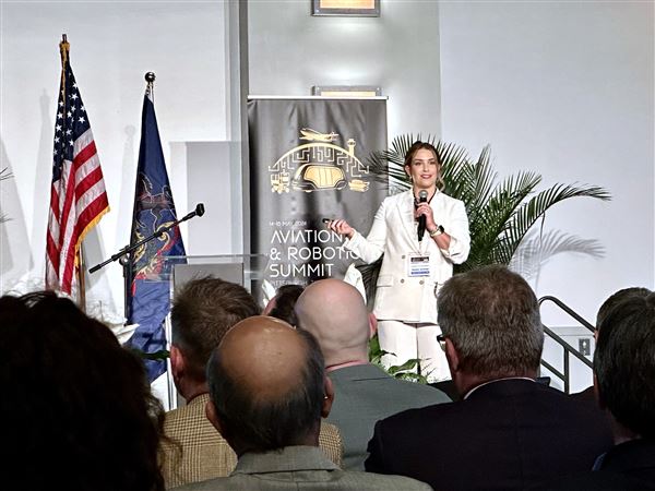 Bernadette Berger, Alaska Airlines’ director of innovation, announces Wednesday a new generative AI tool to help passengers book trips with natural language prompts at the second annual aviation and robotics summit in Pittsburgh. Artificial intelligence is expected to be one of the guiding technologies influencing how airports and airlines plan for the future of travel.