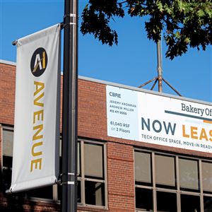 New AI Avenue signs are seen along Penn Avenue in Bakery Square on Thursday, Oct. 10. A newly formed 