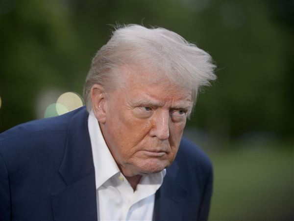 President Donald Trump listening to reporters after arriving at the White House on May 4, 2025.