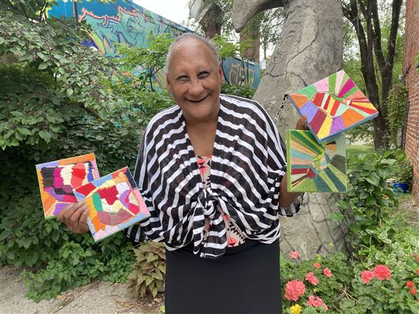 Charmette Young with her art at VaultArt Studio.  