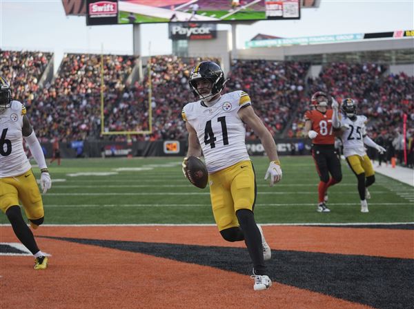 Pittsburgh Steelers linebacker Payton Wilson (41) scores a touchdown after recovering a fumble by Cincinnati Bengals quarterback Joe Burrow during the second half of an NFL football game Sunday, Dec. 1, 2024, in Cincinnati.