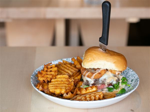 The "Troomy" burger is topped with a house-made secret sauce at Nick’s on Hilltop in Mount Oliver. 
