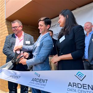 From left to right, Wayne Ginders, John Hoffman, and Naeha Hirani of Ardent Data Centers cut the ribbon at the new data center opened in Robinson.