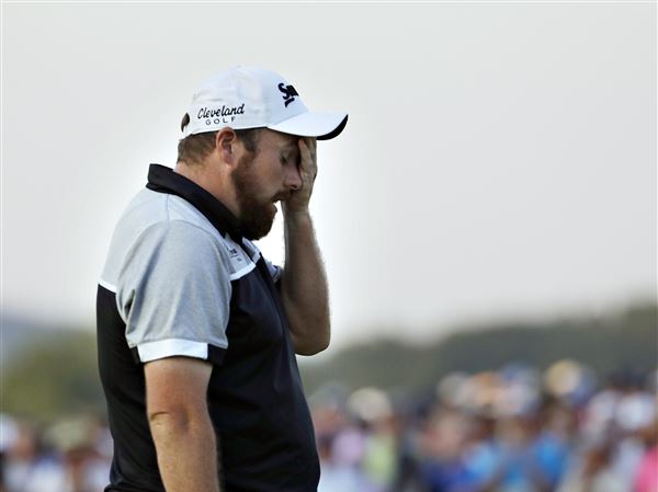 Shane Lowry, of the Republic of Ireland, wipes his face after finishing the final round of the U.S. Open golf championship at Oakmont Country Club on Sunday, June 19, 2016, in Oakmont, Pa. Dustin Johnson won.