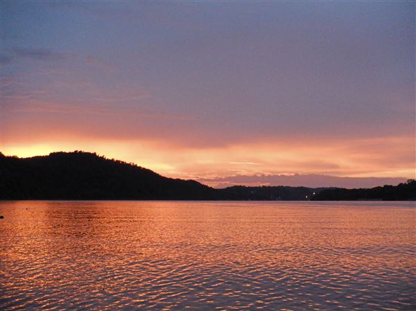Dennis Simpson of Elizabethtown, Ohio, endeavored to sail the length of the Ohio River this summer, from Pittsburgh to Cairo, Ill. He skipped most of the first half due to a broken motor, but set out again from home near Cincinnati and made it to the Mississippi River. Among his favorite photos along the way is this one of sunset near Mauckport, Indiana. (Courtesy of Dennis Simpson)