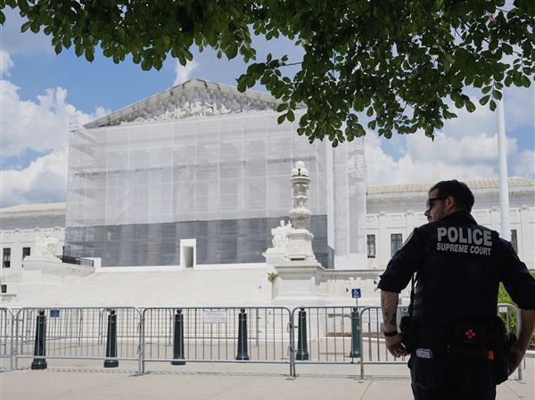 A police officer stands watch outside of the Supreme Court on Thursday in Washington. The Supreme Court agreed on Friday to allow President Donald Trump to end birthright citizenship in some parts of the country, even as legal challenges to the constitutionality of the move proceed in other regions.
