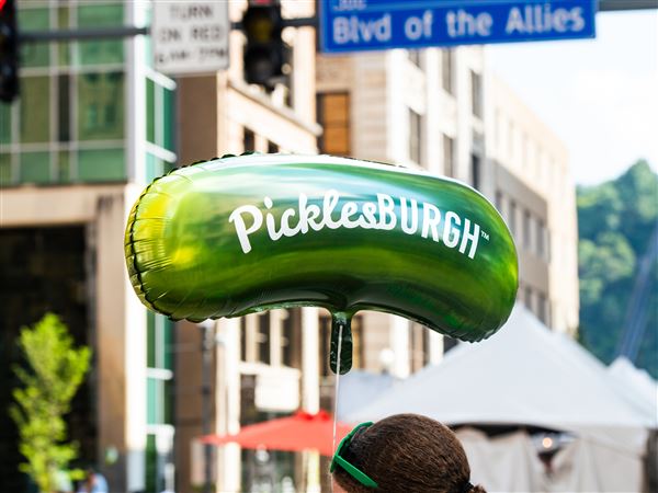 A Picklesburgh balloon floats over the crowd during Picklesburgh in July 2024. 