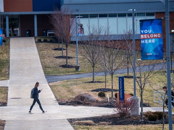 Students walk across the campus of the Community College of Beaver County in Center Township on Wednesday, Feb. 14, 2024.   