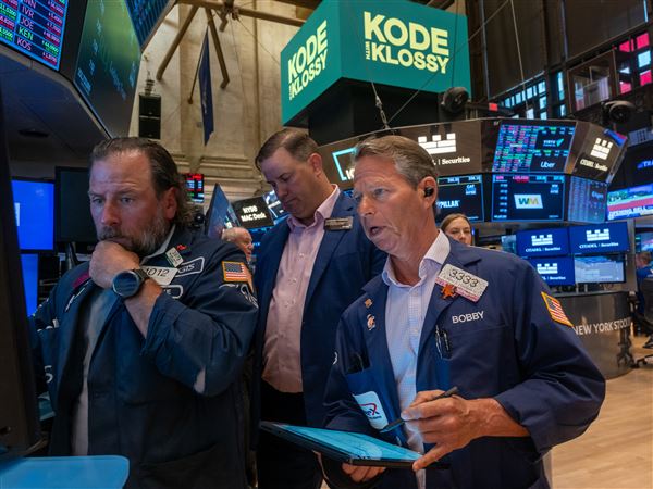 Traders work on the floor of the New York Stock Exchange (NYSE) on Wall Street at the opening bell Monday, July 7, 2025, in the Financial District neighborhood of New York City’s Manhattan borough.