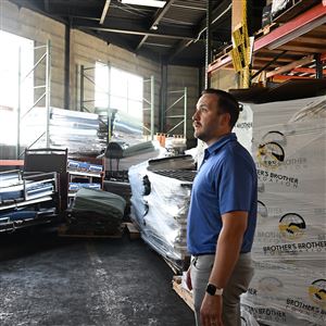 Tanner Rowe, operations manager at Brother’s Brother Foundation, walks through the warehouse on the North Side on Monday, July 7. 2025.