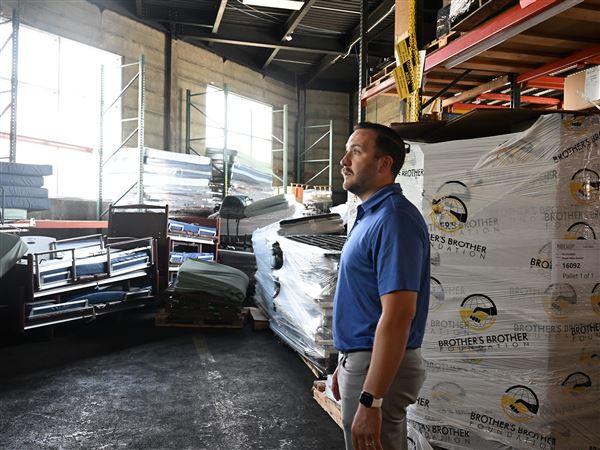 Tanner Rowe, operations manager at Brother’s Brother Foundation, walks through the warehouse on the North Side on Monday, July 7. 2025.
