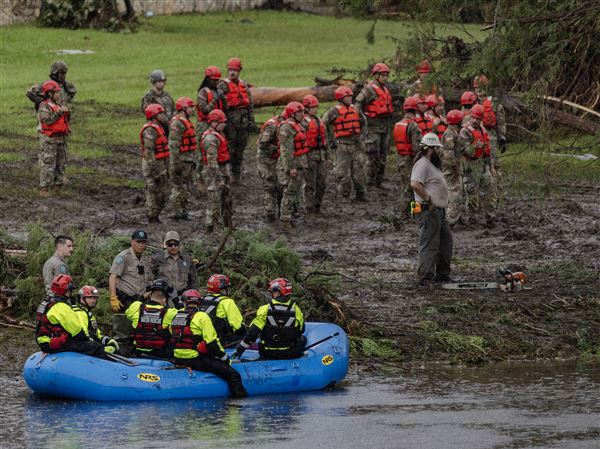 Search and recovery workers dig through debris looking for any survivors or remains of people swept up in the flash flooding at Camp Mystic on July 6, 2025 in Hunt, Texas. Heavy rainfall caused flooding along the Guadalupe River in central Texas with multiple fatalities reported.