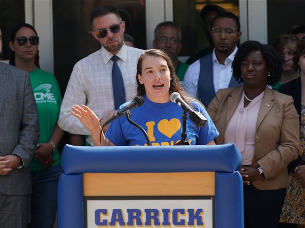 State Rep. Jessica Benham speaks outside of Carrick High School Thursday, August 3, 2023. State Democratic lawmakers toured the school and held a rally following the tour to draw attention to the state budget, which has yet to be finalized. Members of the Pennsylvania House Majority Leadership team and the House Majority Policy Committee were in attendance, part of a statewide tour of schools, primarily in underserved communities. As part of the campaign, lawmakers toured facilities and spoke with officials regarding the need for fair funding in education.  (Sebastian Foltz/Post-Gazette) Slug: SchoolRally0803 