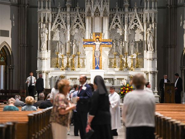 Parishoners file into St. Paul Cathedral to witness the installation of Bishop Mark Eckman, the 13th bishop of the Catholic Diocese of Pittsburgh, Monday, July 14, 2025.