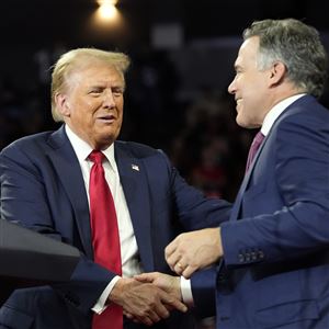 Republican presidential nominee former President Donald Trump shakes hands with Pennsylvania Senate candidate Dave McCormick at a campaign rally at the Santander Arena, Wednesday, Oct. 9, 2024, in Reading, Pa.