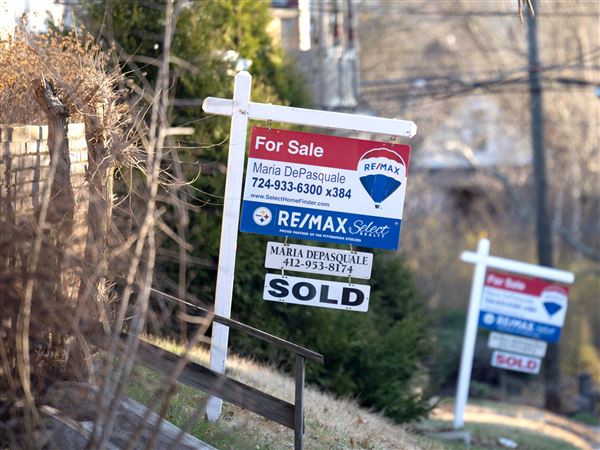 Several houses are shown along N. Dallas Avenue near Penn Avenue in Point Breeze with “For Sale” signs in the front yard, Friday, March 21, 2025. 