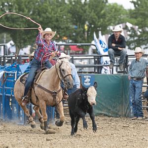 Paige Pursel of Fredonia, Pennsylvania, competes in the calf roping competition during the rodeo show at the Washington County Fair in Washington, Pa. on Sunday, August 11, 2024. 
