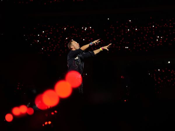In this file photo, Chris Martin of Coldplay performs during the band's Music Of The Spheres World Tour at D. Y. Patil Sports Stadium in Navi Mumbai, Saturday, Jan. 18, 2025.