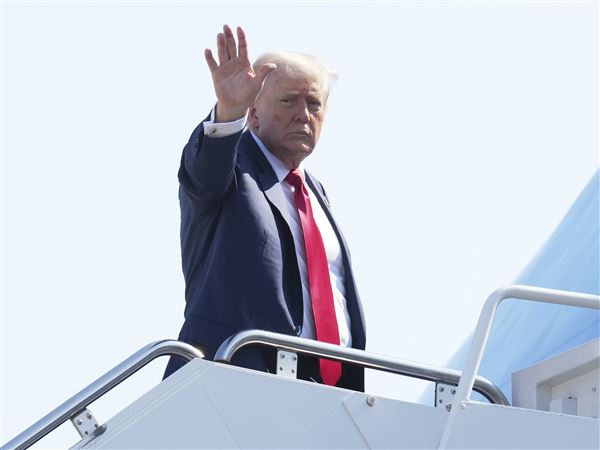 President Donald Trump waves as he boards Air Force One at Joint Base Andrews, Md., Friday, July 25, 2025, en route to Scotland.