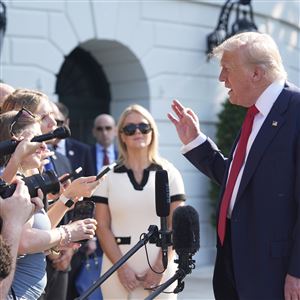 President Donald Trump speaks with reporters Friday before departing on Marine One from the South Lawn of the White House in Washington. Trump was traveling to Scotland as his family’s business prepares for the Aug. 13 opening of a new golf course in Aberdeenshire billed as “the greatest 36 holes in golf.”