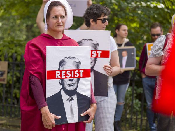 People take part in a Stop Trump Scotland protest outside the U.S. Consulate in Edinburgh, as President Donald Trump begins his five-day private trip to the country at his Turnberry golf course in South Ayrshire on Saturday.