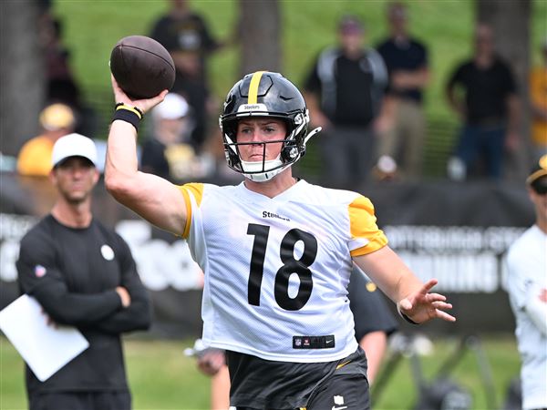 Steelers rookie quarterback Will Howard rolls out to pass at Training Camp at Saint Vincent College in Latrobe Thursday, July 31, 2025. 