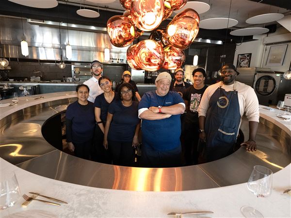 Chef Chris Frangiadis, center, general manager and beverage director Cecil Usher, right, and the staff at One by Spork.  