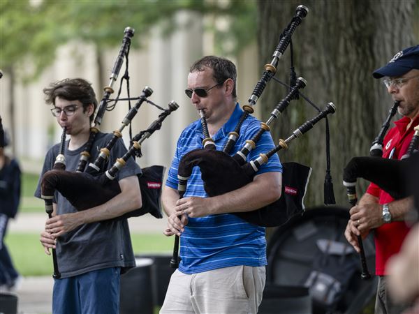 Members of the Carnegie Mellon Pipes and Drums band practice before competing in the World Pipe Band Championships in Glasgow, Scotland.