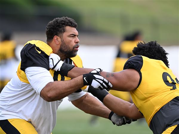 Steelers defensive lineman Cam Heyward runs a defensive line drill against rookie Derrick Harmon at Steelers Training Camp at Saint Vincent College in Latrobe on Tuesday, August 5, 2025. 