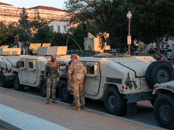 WASHINGTON, DC - AUGUST 12: National Guard troops gather near the Washington Monument as part of President Trump's mobilization of law enforcement on August 12, 2025 in Washington, DC. The Trump Administration placed the DC Metropolitan Police Department under federal control and deployed federal officers and the National Guard to the District to assist in crime prevention in the nation’s capital.