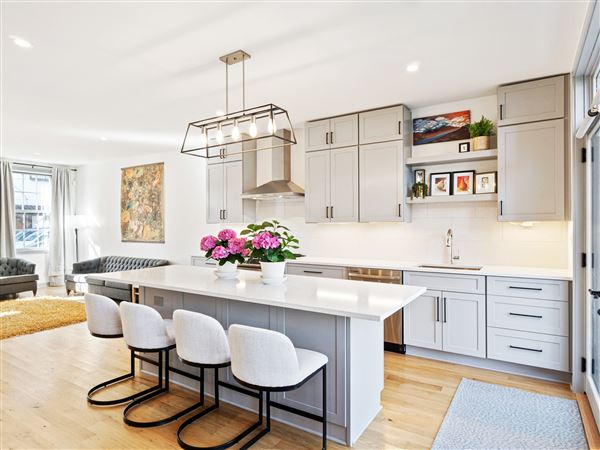 The kitchen features a large island and lots of cabinetry.