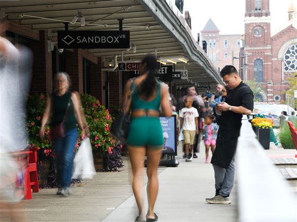 People walk along the Strip District Terminal on Thursday, Aug. 14, 2025. The Strip District’s population has more than tripled since 2015, and is poised for another population boom.