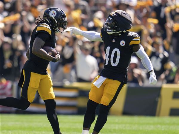 Pittsburgh Steelers cornerback Jalen Ramsey, left, and safety Jabrill Peppers (40) celebrate Ramsey's interception during the first half of an NFL football game against the Seattle Seahawks, Sunday, Sept. 14, 2025, in Pittsburgh. 