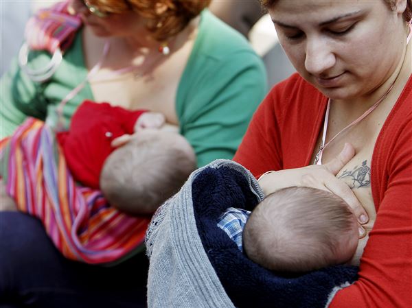 Mothers breastfeed their babies during a mass breastfeeding in celebration of World Breastfeeding Week, in Thessaloniki, Greece Sunday, Nov. 3, 2013. Mothers breast fed their babies in the 4th Panhellenic public breastfeeding taking place simultaneously in 39 cities of Greece. About 550 lactating mothers took part.