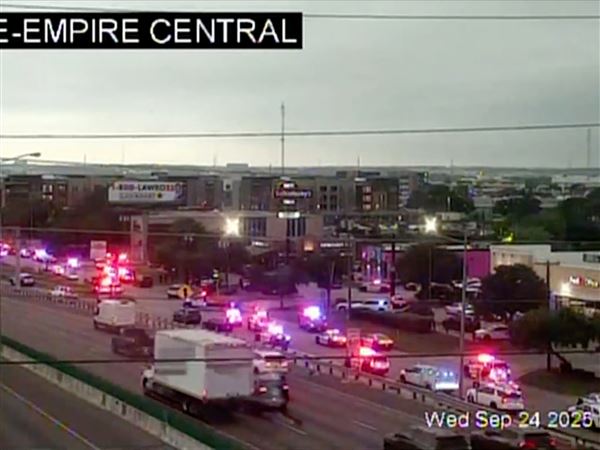 This traffic camera image shows heavy police presence off I-35E — close to a U.S. Immigration and Customs Enforcement office — on Thursday, Sept. 24, 2025, in northwestern Dallas.